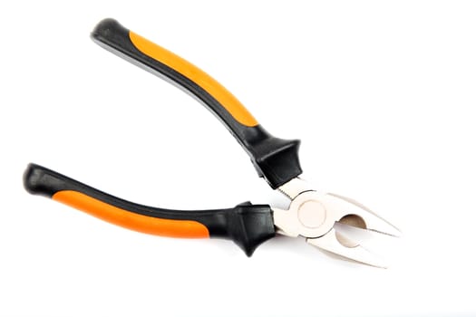 Studio shot of orange with black pliers isolated on white background.