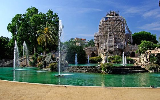 Ciutadell park in centre of Barcelona. Fountain and reconstruction of building. Spain.