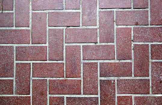 Floor tiled with red bricks. Good as backdrop or background.