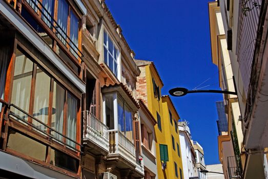 Typical narrow street of Lloret de Mar, Spain.