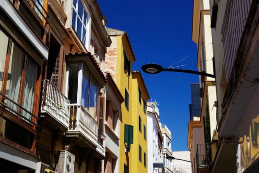 Typical narrow street of Lloret de Mar, Spain.