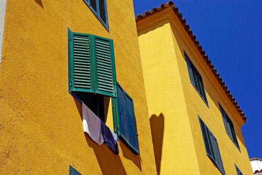 Yellow architecture of small Lloret de Mar city. Costa Brava, Spain.