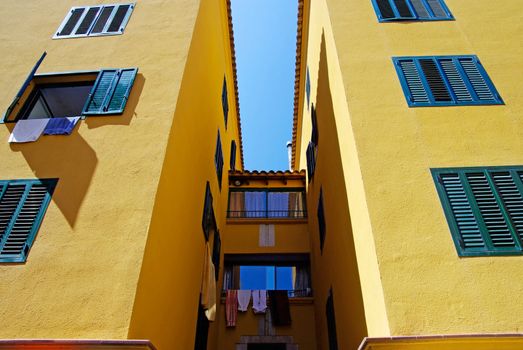 Yellow architecture of small Lloret de Mar city. Costa Brava, Spain.