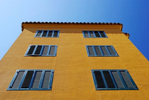 Yellow architecture of small Lloret de Mar city. Costa Brava, Spain.