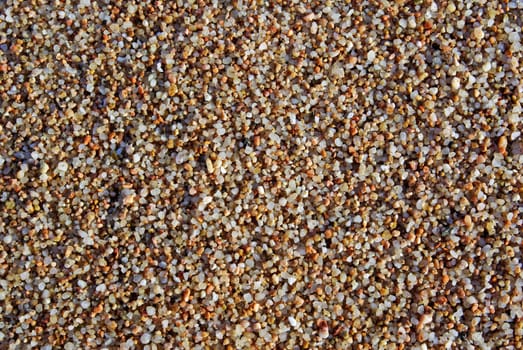 Wet multicolored sand as background or backdrop.