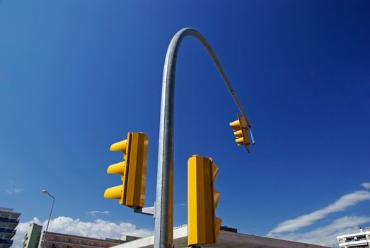 Curve composition with yellow street-traffic control lights. Lloret de Mar, Spain.