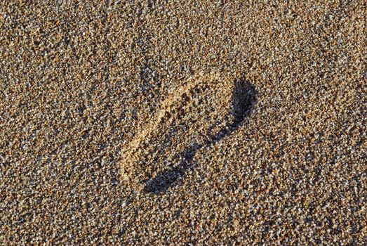 Foot print on the mediterranean beach. As backdrop or background.