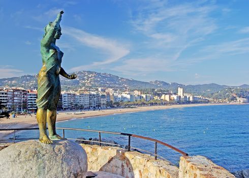 Bronze statue of woman looking to the sea. Lloret de Mar, Costa Brava, Spain.