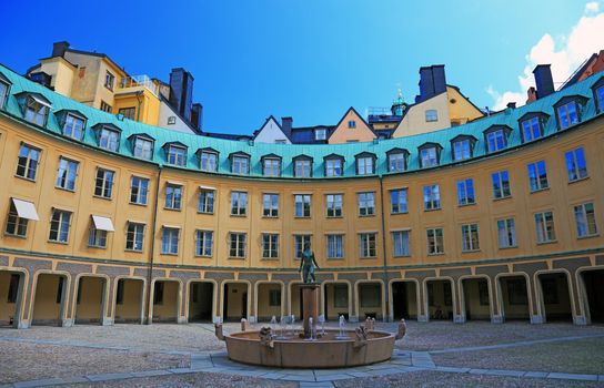 Stockholm architecture with fountain and statue.