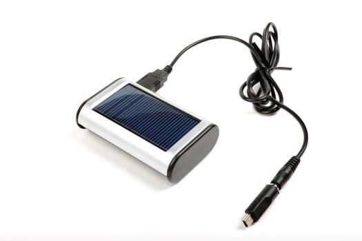 Solar charger for mobile phones isolated on white background.