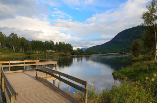 Pier on lake in Norway before sunset, Scandinavian Europe.