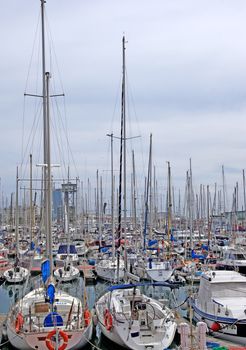 Yachts and sail boats in Barcelona harbour.