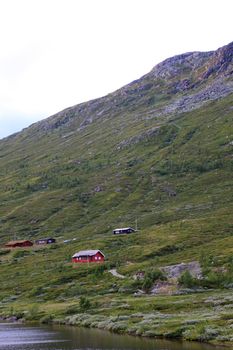 Mountain landscape with houses in Norway. Scandinavian Europe.