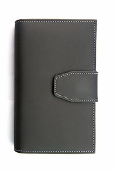 isolated of black fake leather holder notebook on white