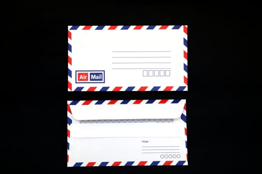 isolated Vintage air mail Envelope on black