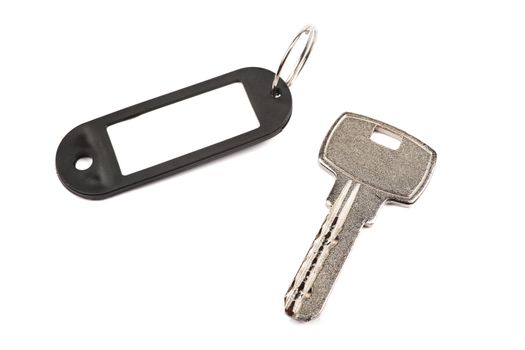 Key and black trinket with empty for your design space isolated on white background.