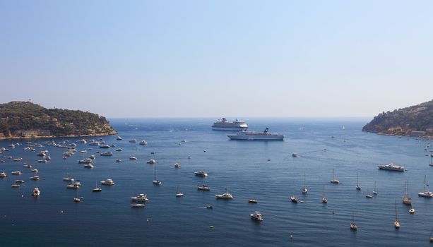 Panoramic view of bay near city of Nice. Many sail boats, cruise ships.