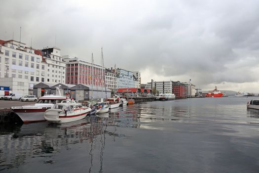 Norwegian harbor of the city of Bergen. Dramatic weather, scandinavian summer.