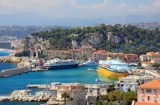 Harbor with luxury yachts, cruise ships of the city of Nice, France.