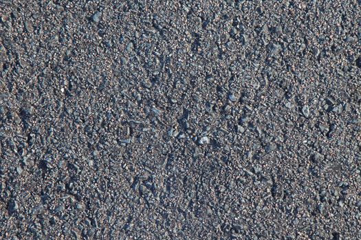 Gray asphalt as textured background or backdrop.