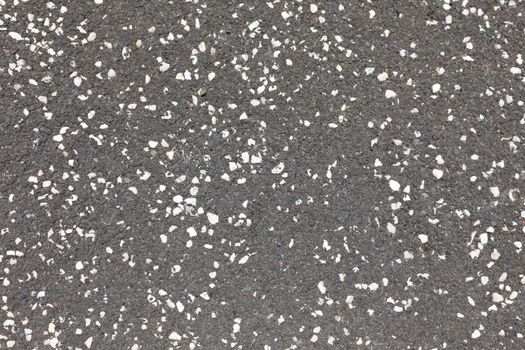 Abstract grey with white dottes asphalt as background or backdrop.