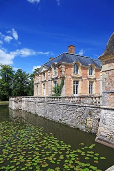 Old french mansion with lake near it, now a museum, France, Europe.
