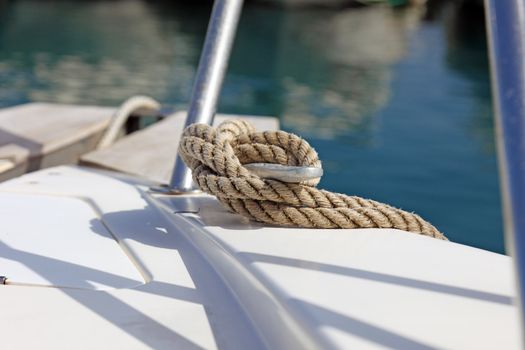 Boat rope on dock, fixing yacht.