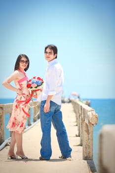 portrait of couples at pier on the beach