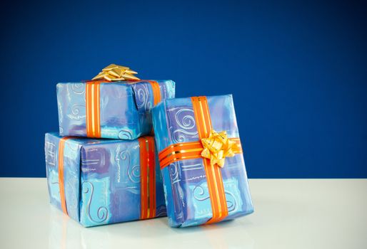 Christmas presents against blue background