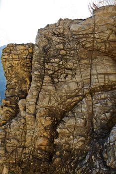 Portrait of cliff depicting elephants heads along the public foot leading up to Shiva Devi Temple a Hindu pilgrimage on the Trikuta Mountains of Himalayas