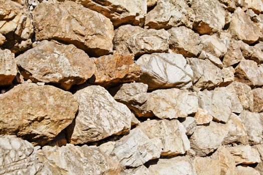 Horizontal landscape of an angled shot of an example of Kashmiri dry stone wall along the footpath to Shiva Devi temple of the Trikuta mountain range of the Himalayas in northern India.