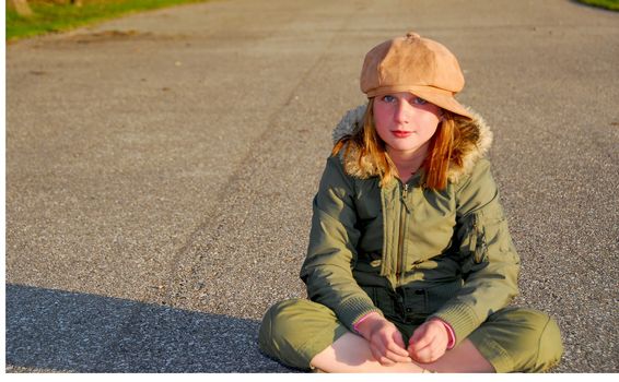 Girl in winter or fall clothes outside