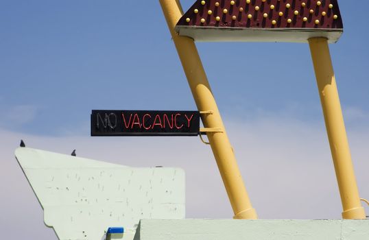 Neon "vacancy" sign on a funky old roadside motel.