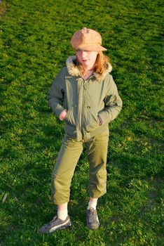 Girl in fall clothes standing outside