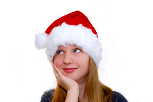 Portrait of a young girl wearing Santa's hat isolated on white background