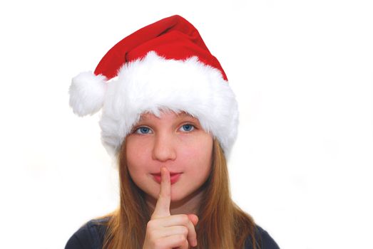 Portrait of a young girl wearing Santa's hat isolated on white background