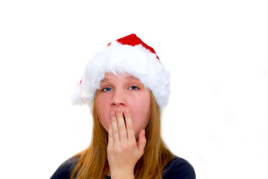 Portrait of a young girl wearing Santa's hat isolated on white background