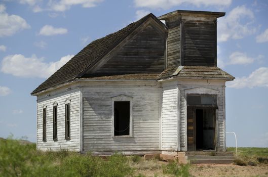 Neglected and abandoned rural church shot with a long lens.