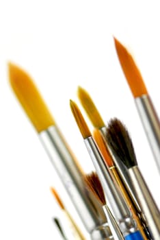 Closeup of paintbrushes on white background