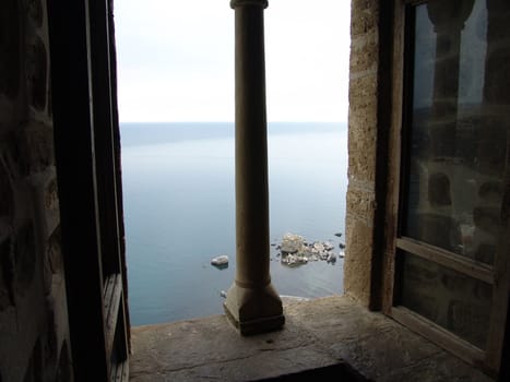 Fortress window with a kind at the seaside                               