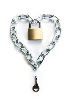 A Padlocked Chain Shaped Lock a Heart and the Key to Open It