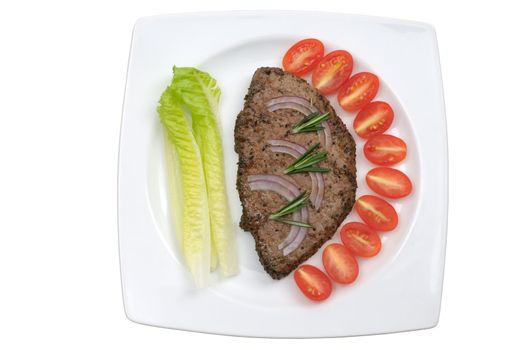 Grilled pepper steak with vegetable on a plate isolated on white background