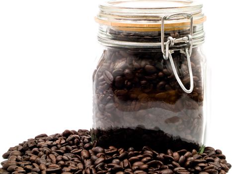 Coffee Beans and a Clear Glass Container with more Coffee