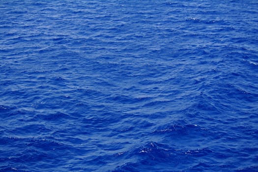 Blue sea water surface with ripple as background