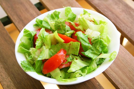 Healthy vegetarian Salad on the white plate over white 