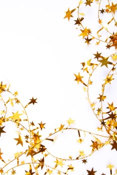 Golden stars and spangles as holiday background 