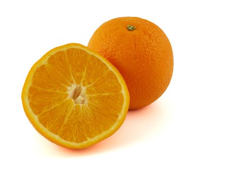 Oranges, sliced in half and wedges isolated on white