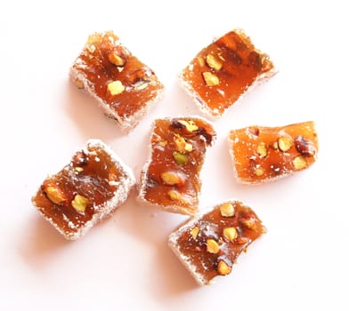Sweet turkish delights with nuts on white background