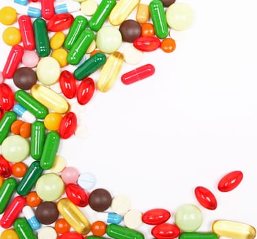 Different colorful pills on white background 