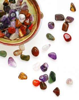 Colorful semiprecious stones on white background